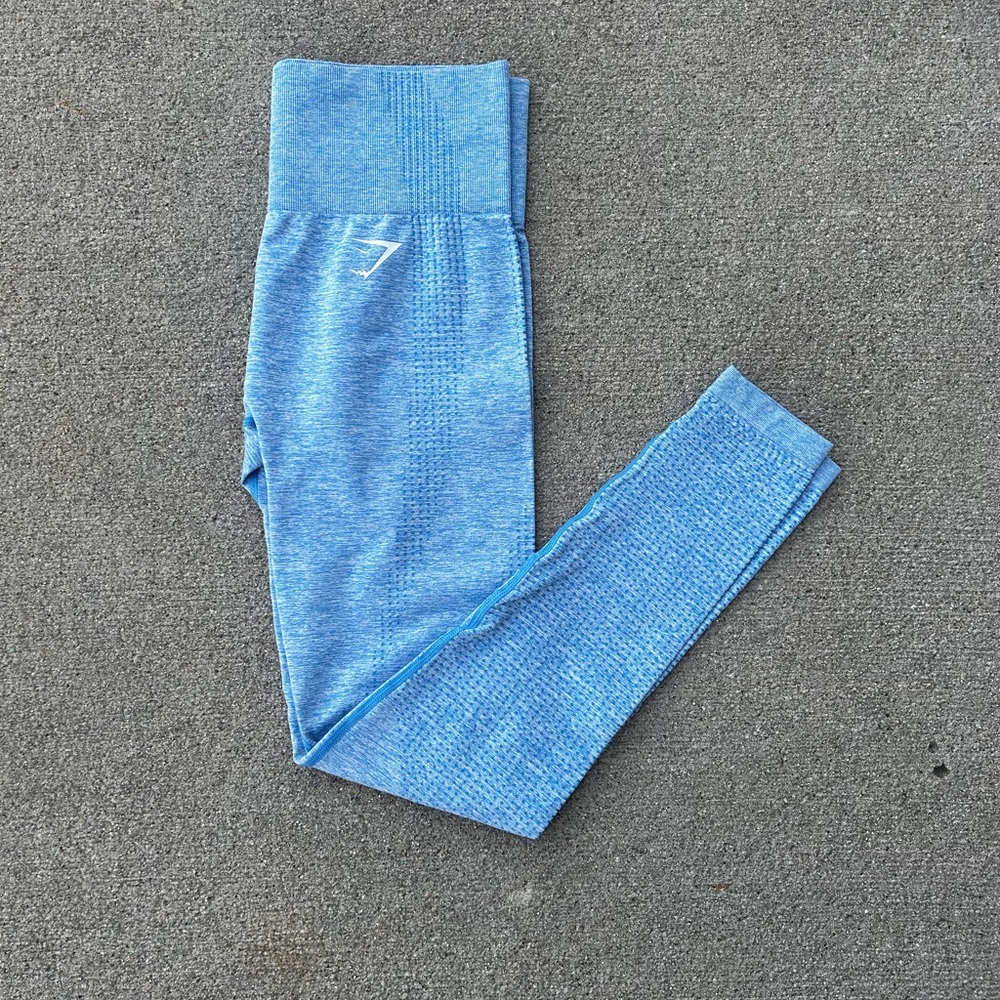 Women’s blue Gymshark athletic leggings with logo